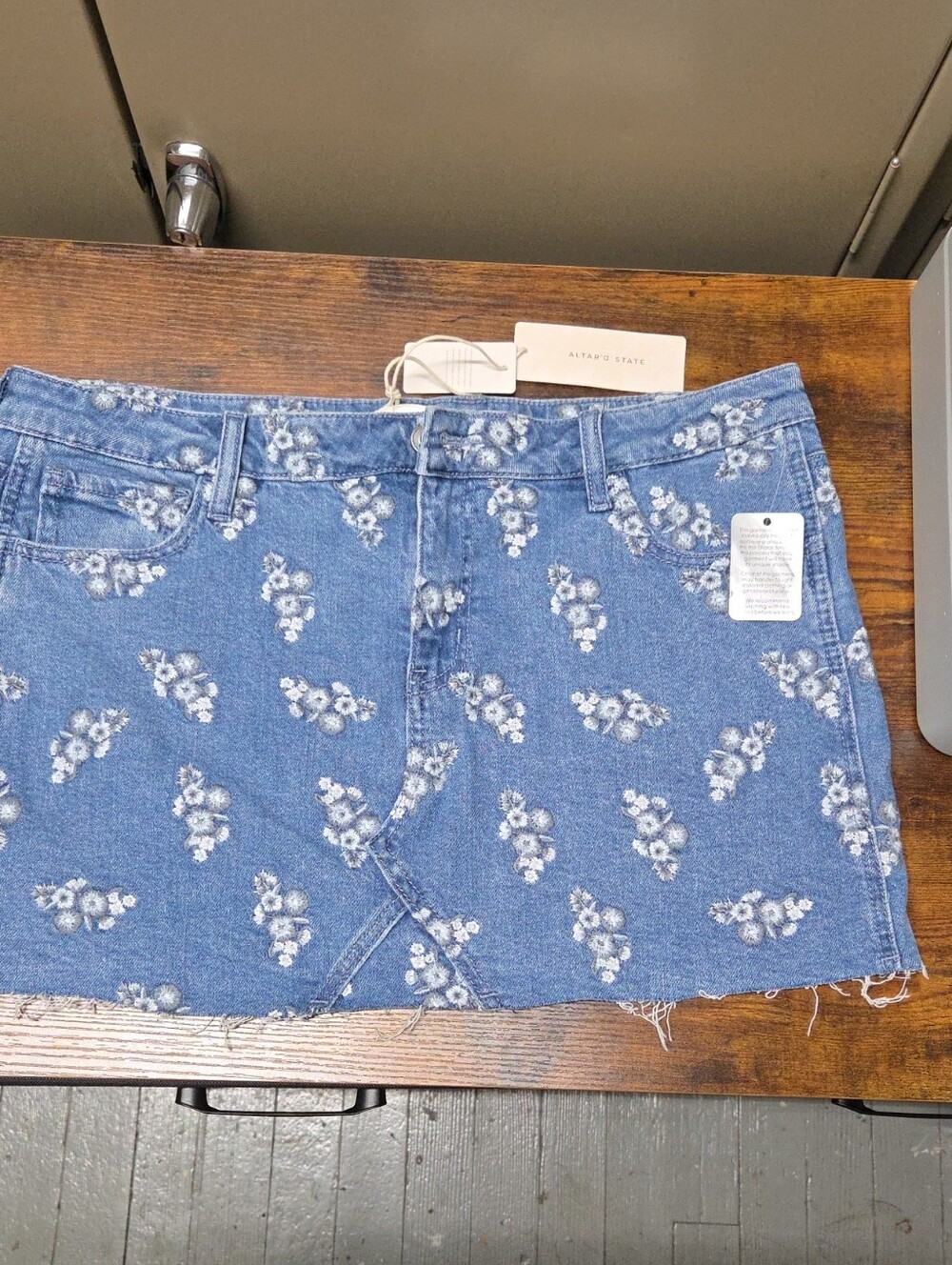 Altar'd State Blue Denim Mini Skirt with White Floral Motif